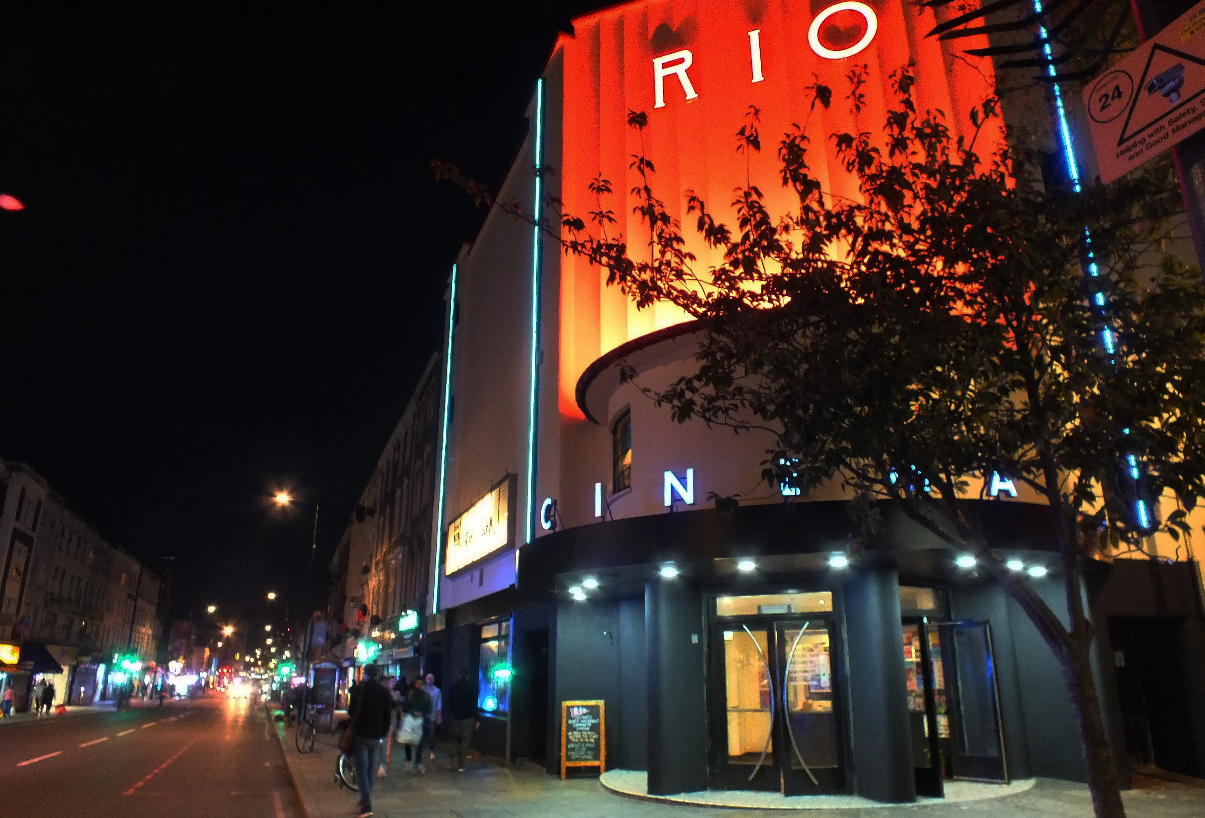 The Rio Cinema in Dalston, east London, lit up orange at night